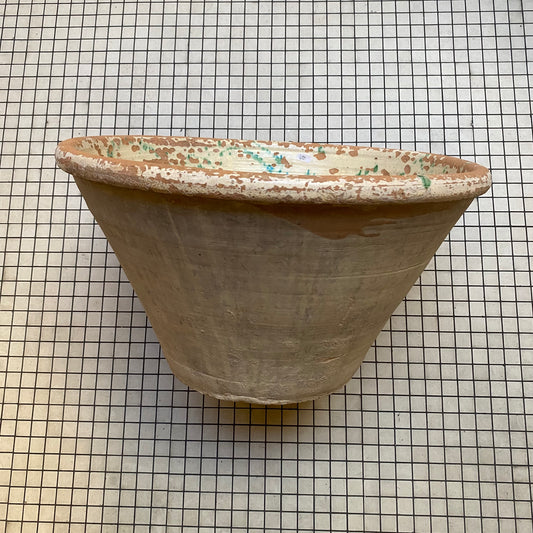Antique tian bowl, side view with glazed rim and unglazed terracotta body