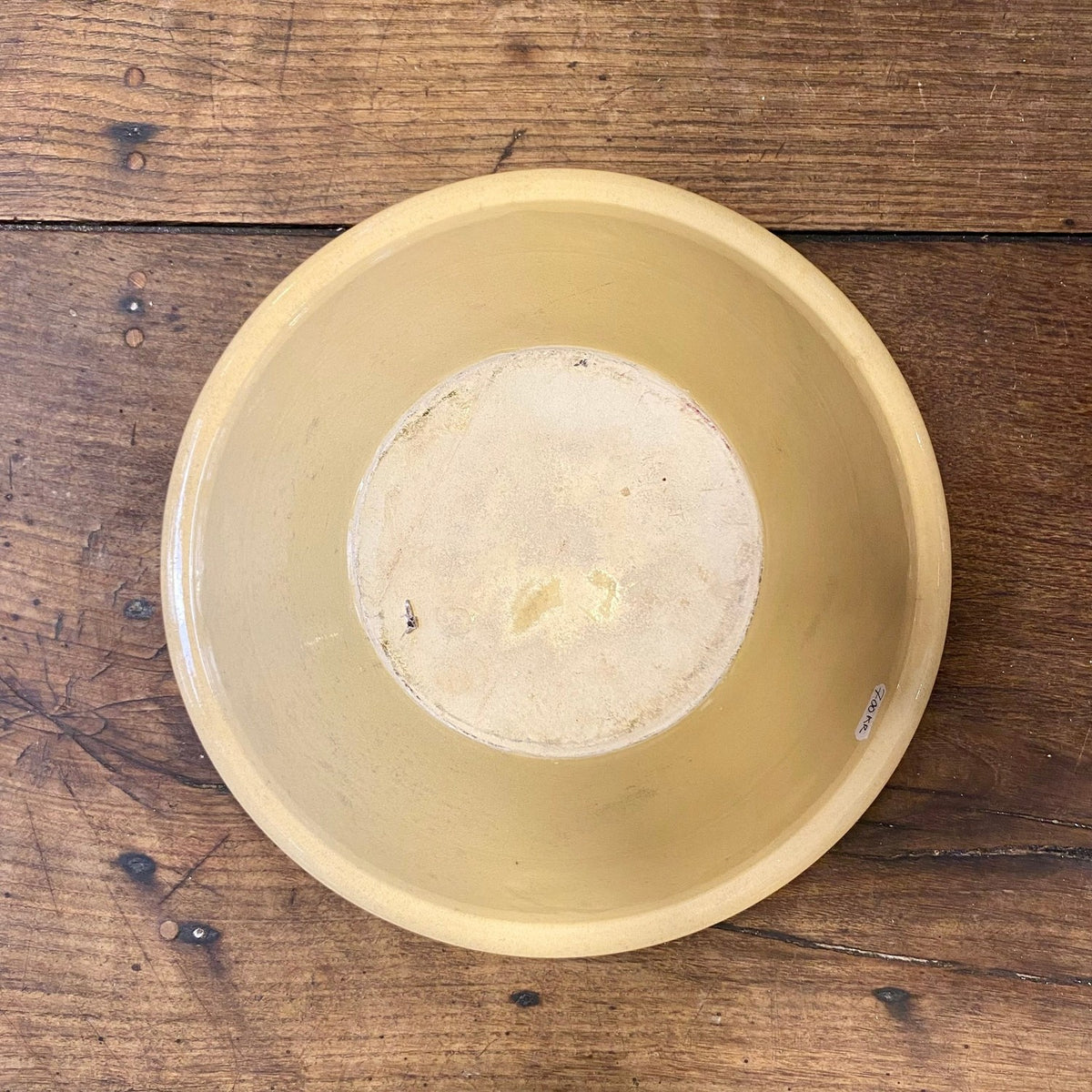 Underside of the large Provençal cicada serving bowl showing the base