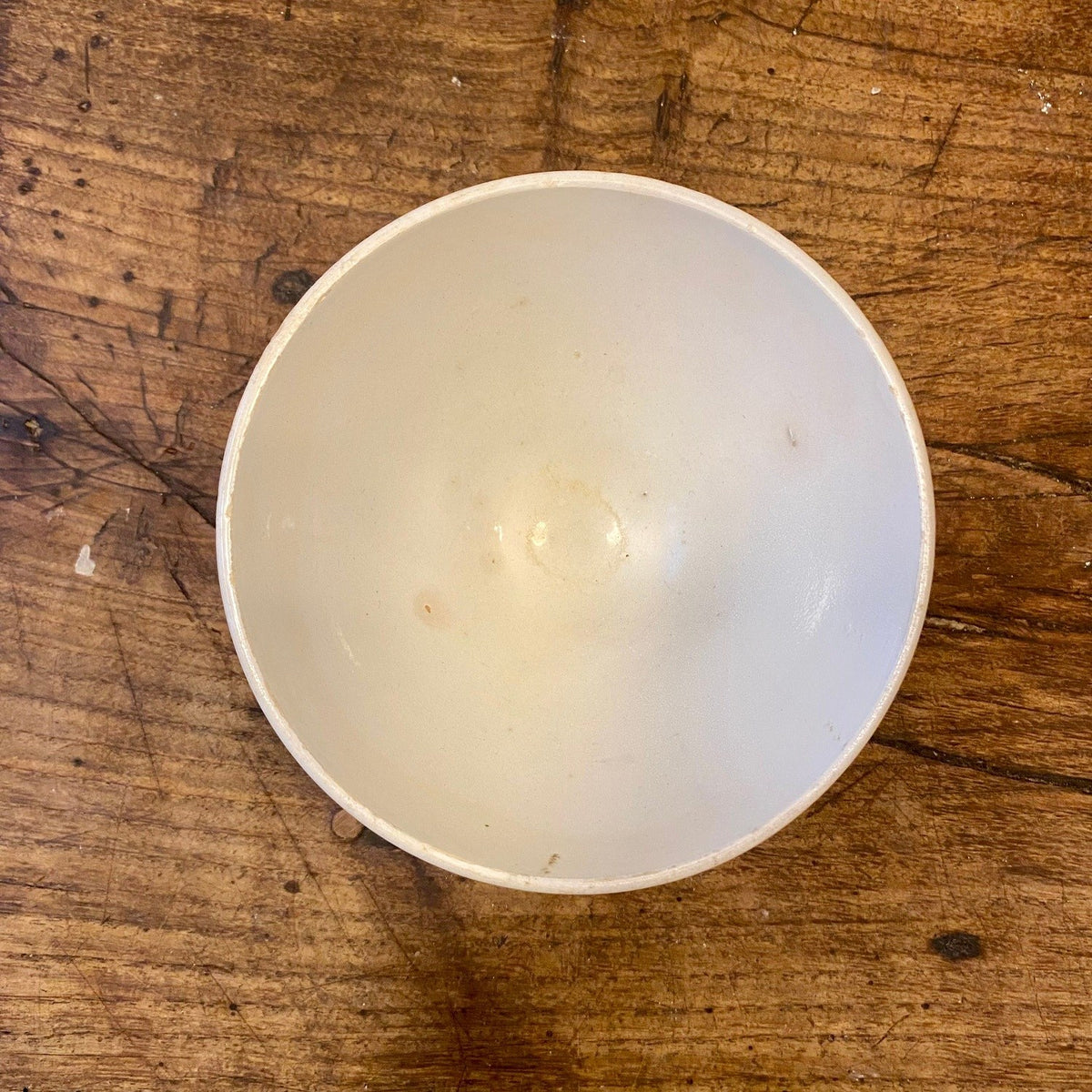 Inside of a vintage French café au lait bowl in off-white