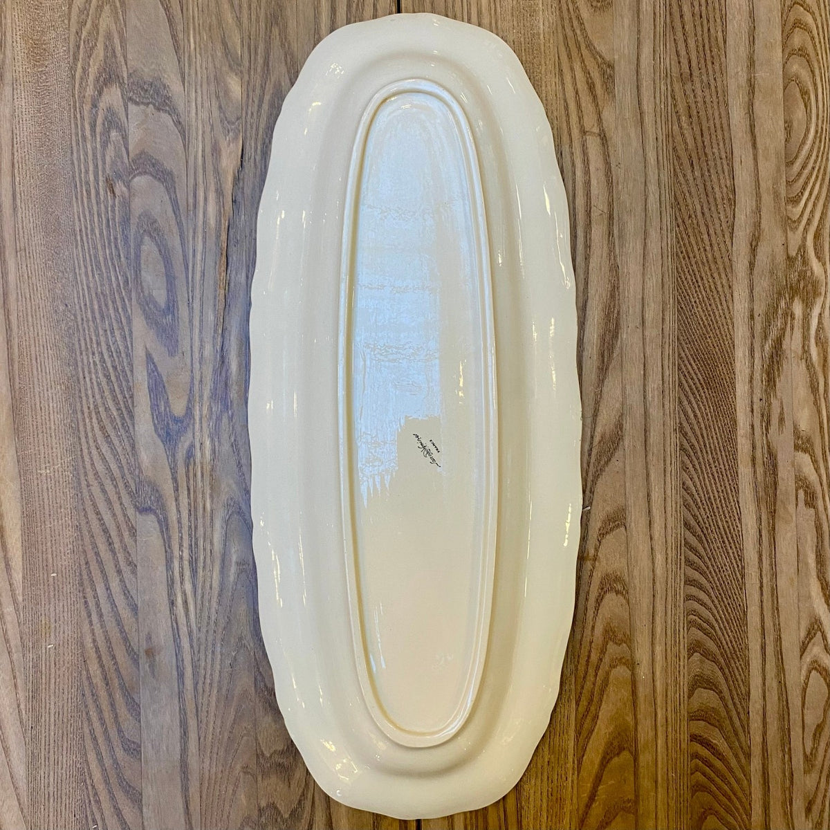 Underside of a vintage French serving platter with the Sarreguemines France mark