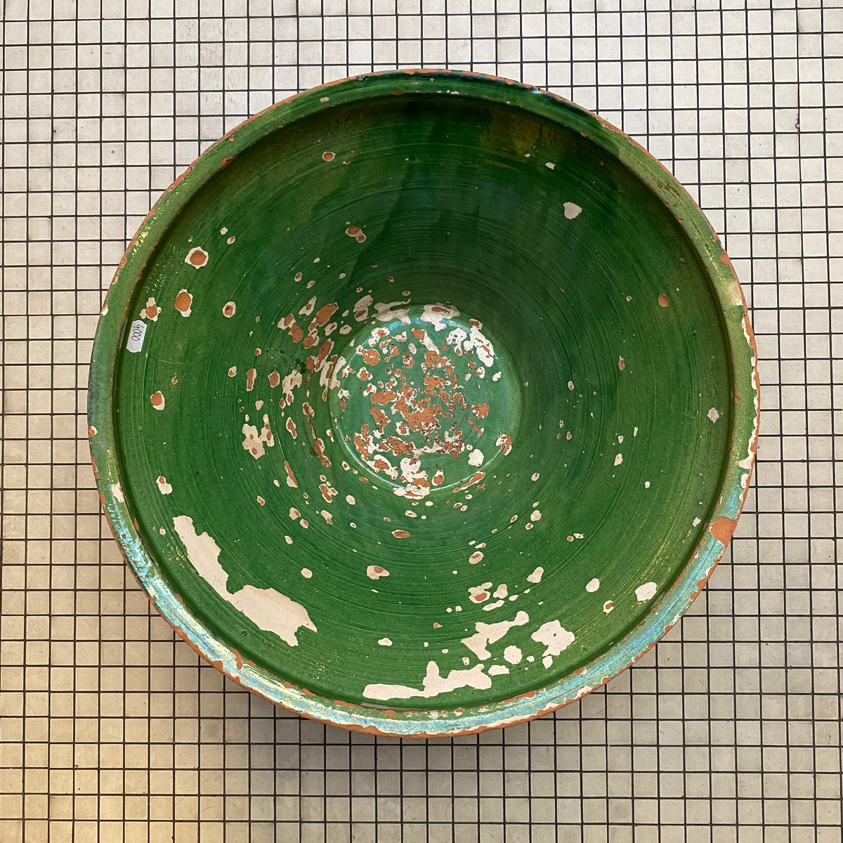 Antique green-glazed Provençal tian bowl seen from above