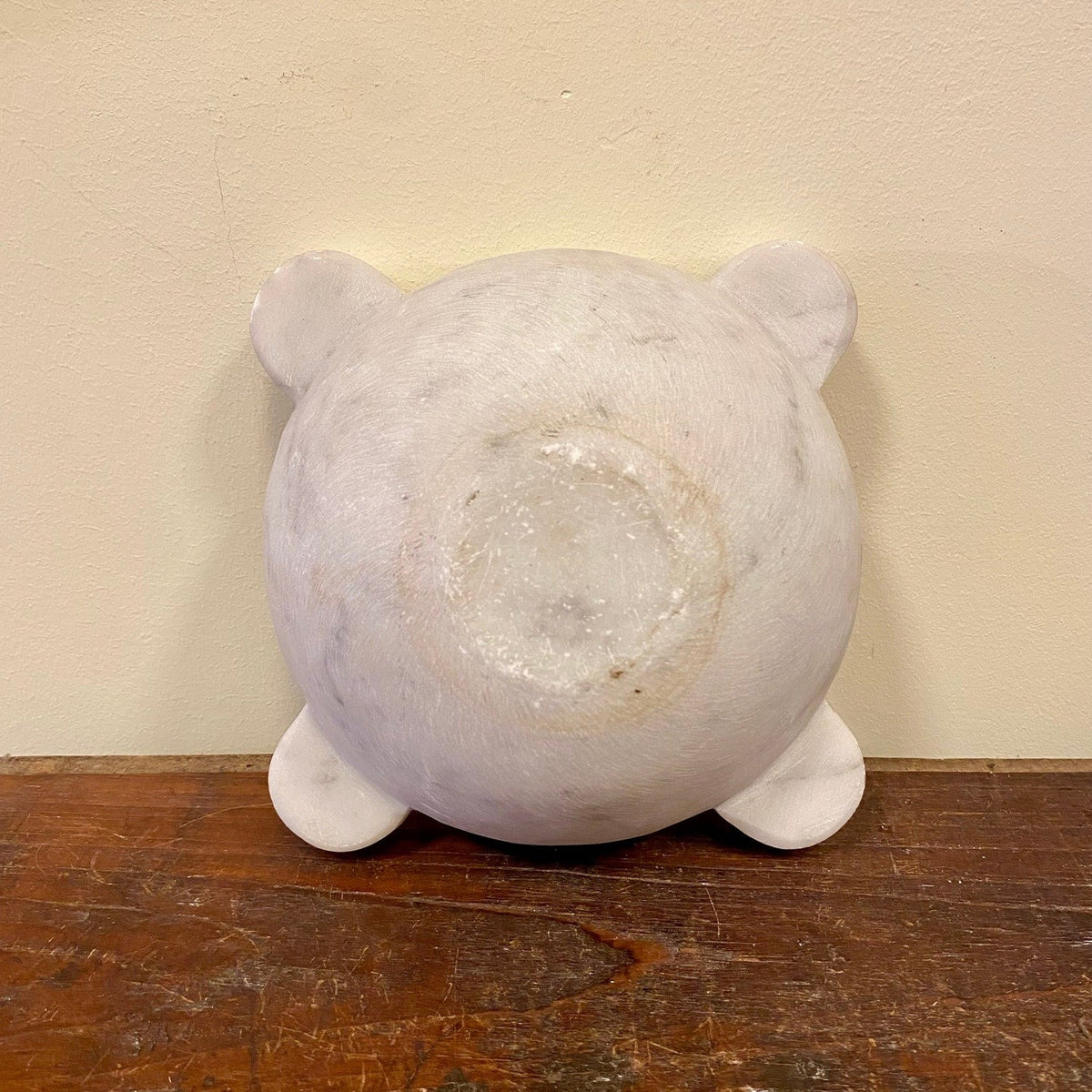 Underside of the marble mortar with four lugs