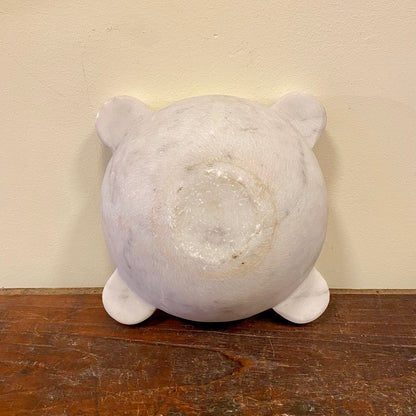 Underside of the marble mortar with four lugs