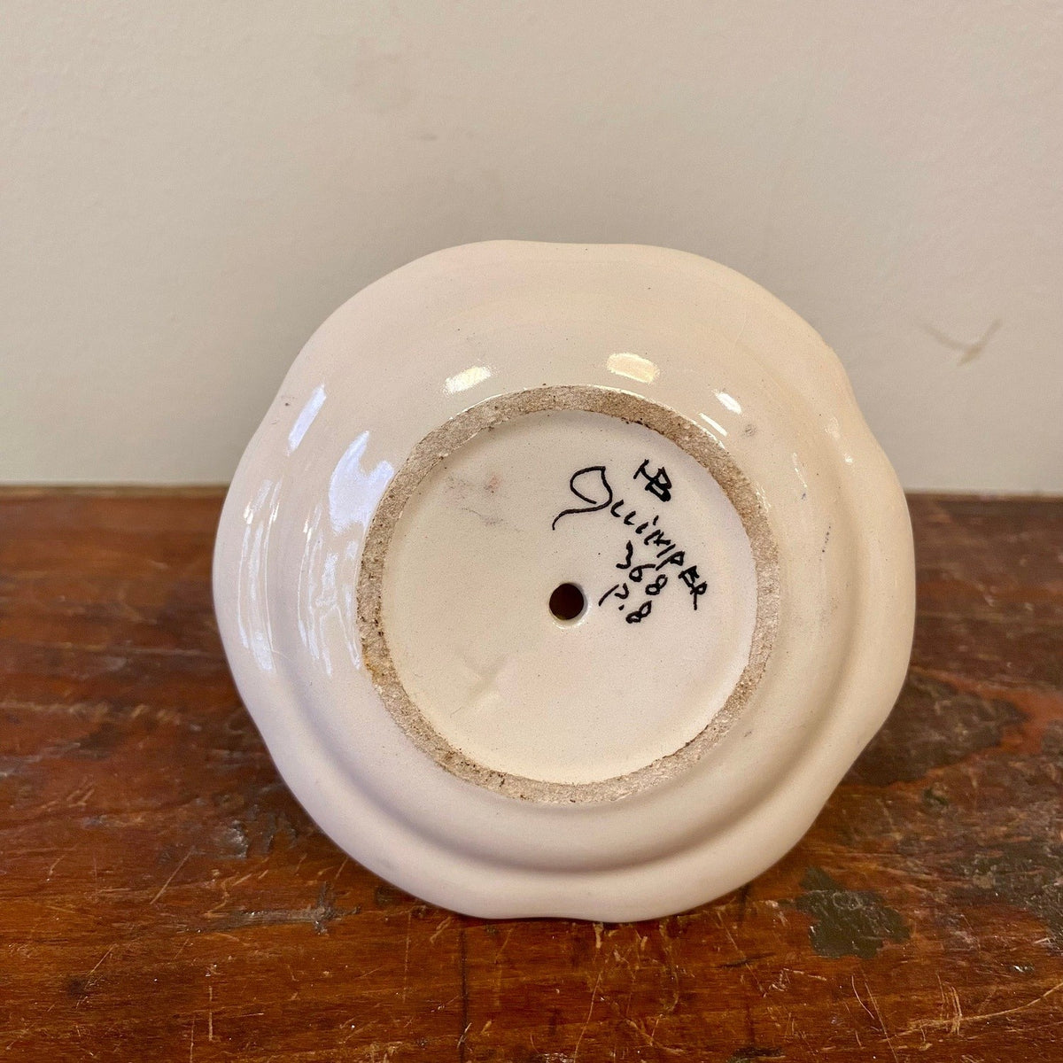 Underside of HB Quimper egg cup with maker's mark