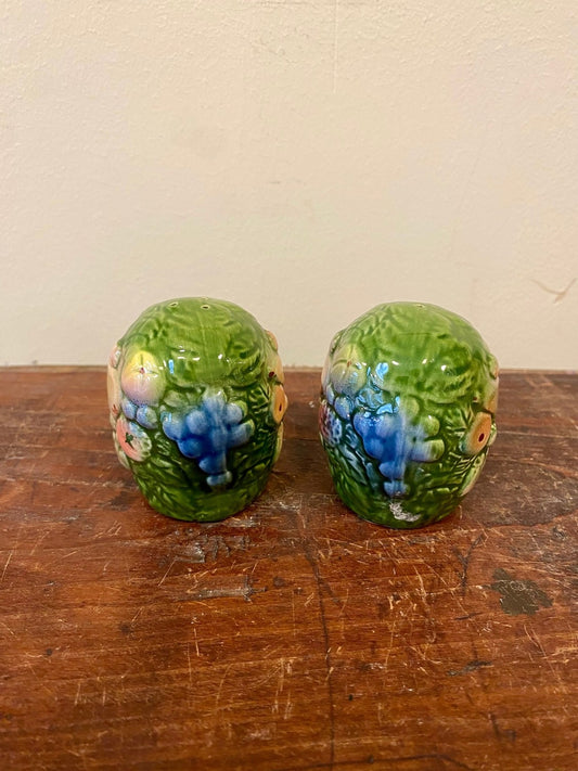 Pair of green fruit-relief salt and pepper shakers, front view
