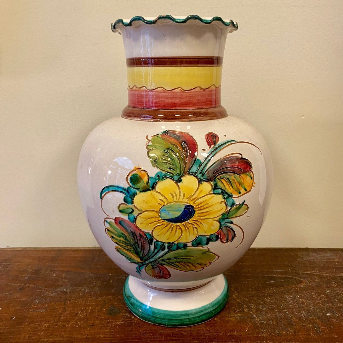Vintage hand-painted ceramic vase with a yellow flower and leaves, other side