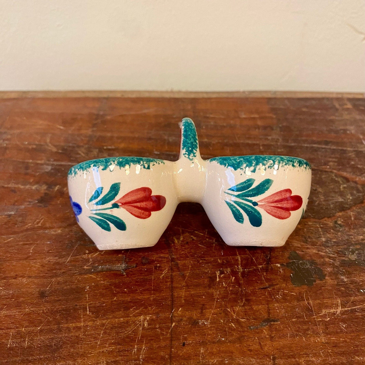 Double egg cup with painted red tulips, side view