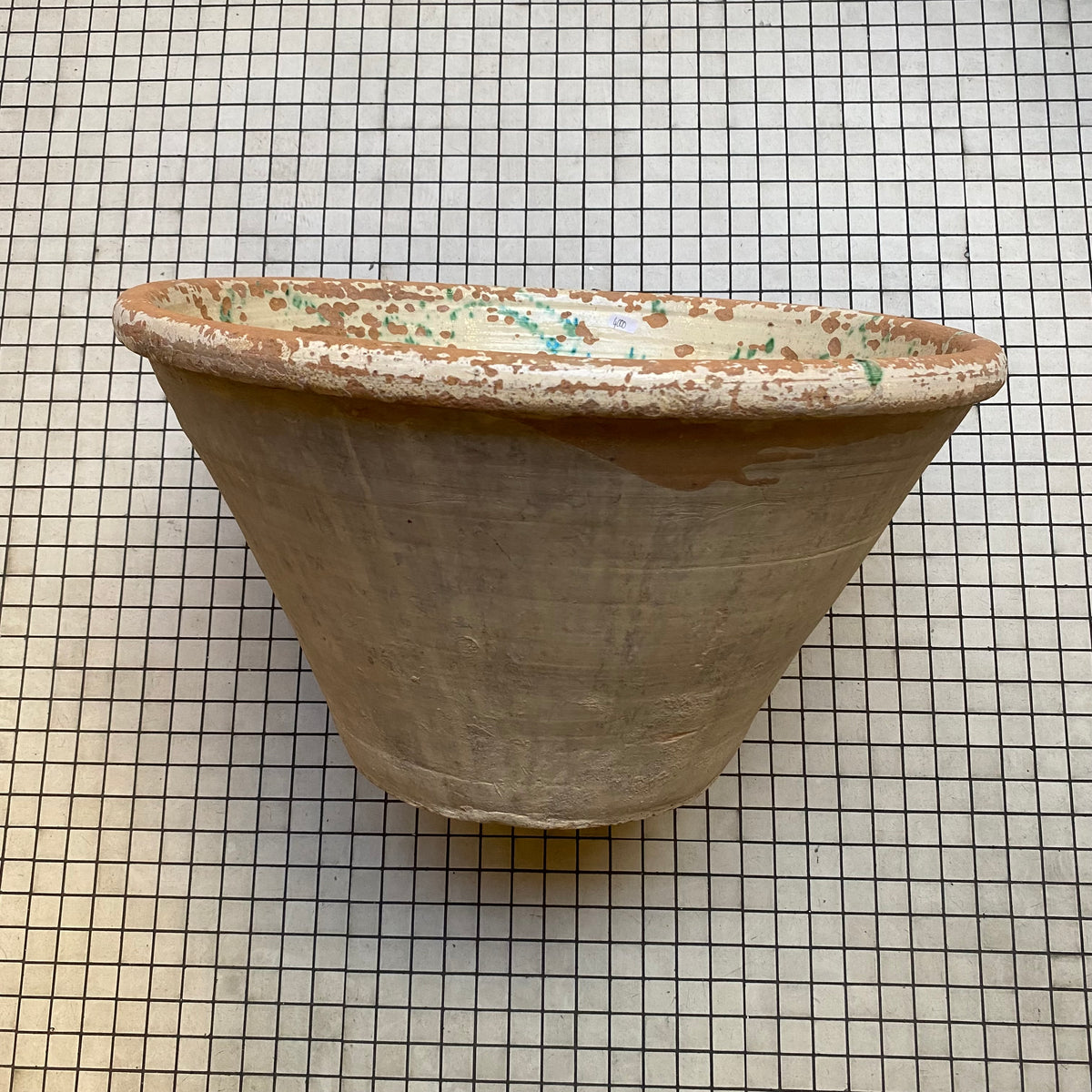 Antique tian bowl, side view with glazed rim and unglazed terracotta body