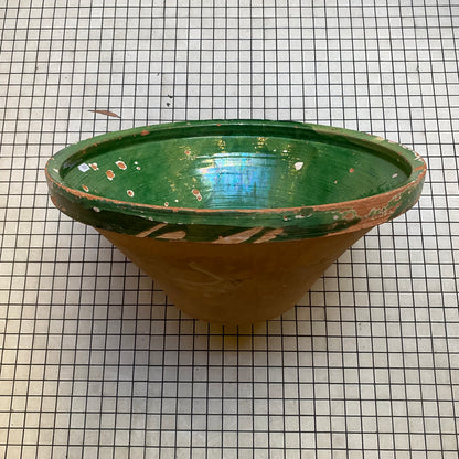 Antique tian bowl, side view with green-glazed rim and unglazed terracotta body