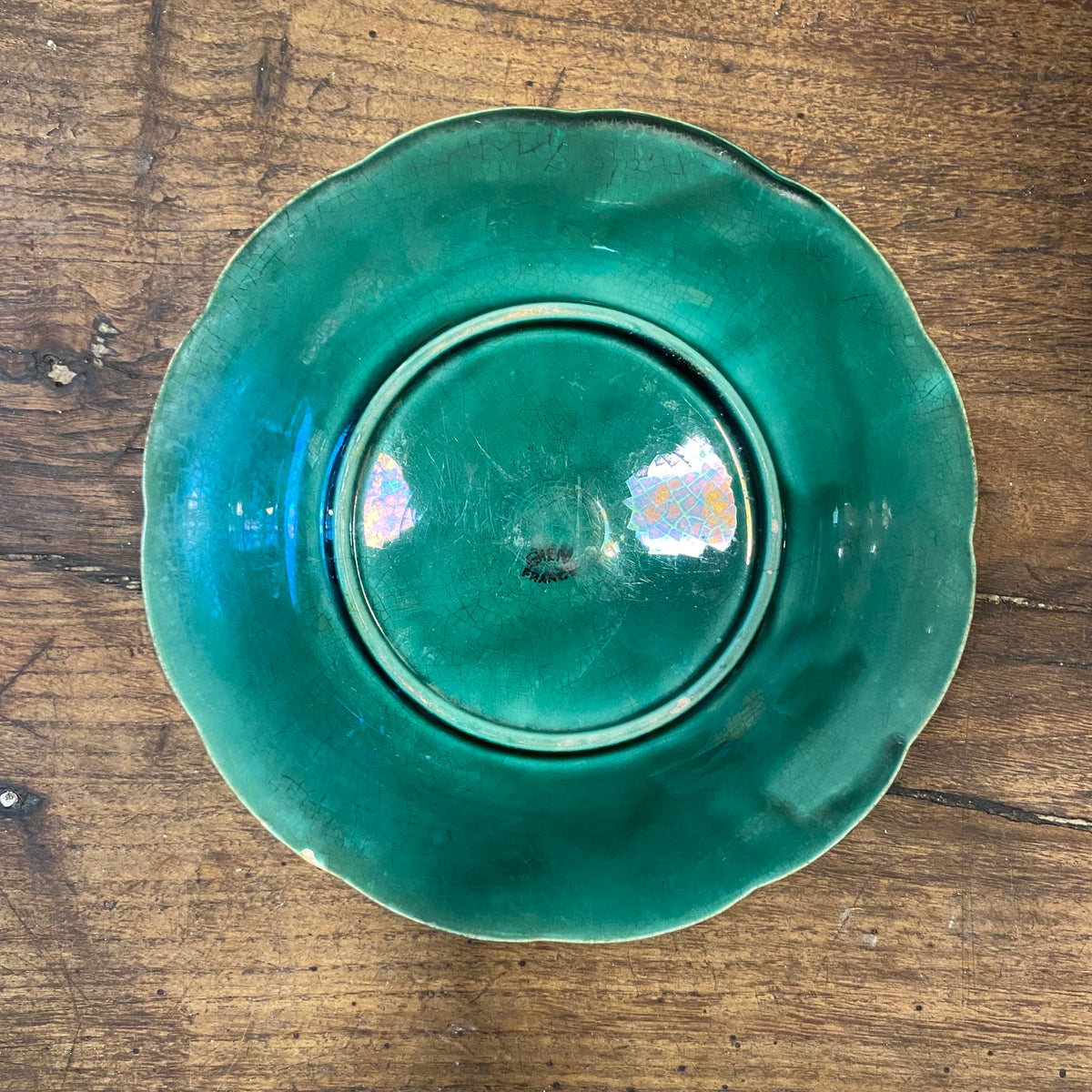 Back of the plate with the Gien France stamp and fine crazing in the green glaze