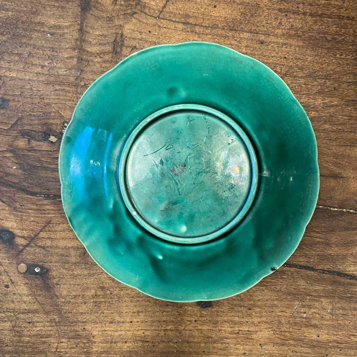 Back of the fourth plate, with crazed glaze on the foot and rim