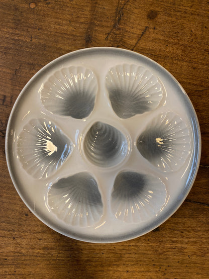 French vintage oyster plate in white glazed ceramic with shell-shaped compartments / Fransk ostronfat i vit glaserad keramik med snäckformade fack