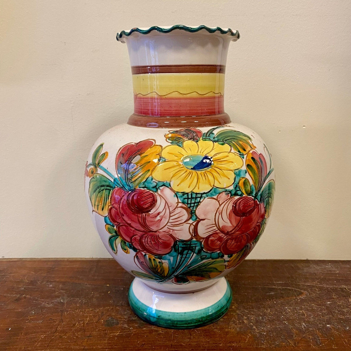 Vintage hand-painted ceramic vase with a large yellow flower and red and pink roses, front view