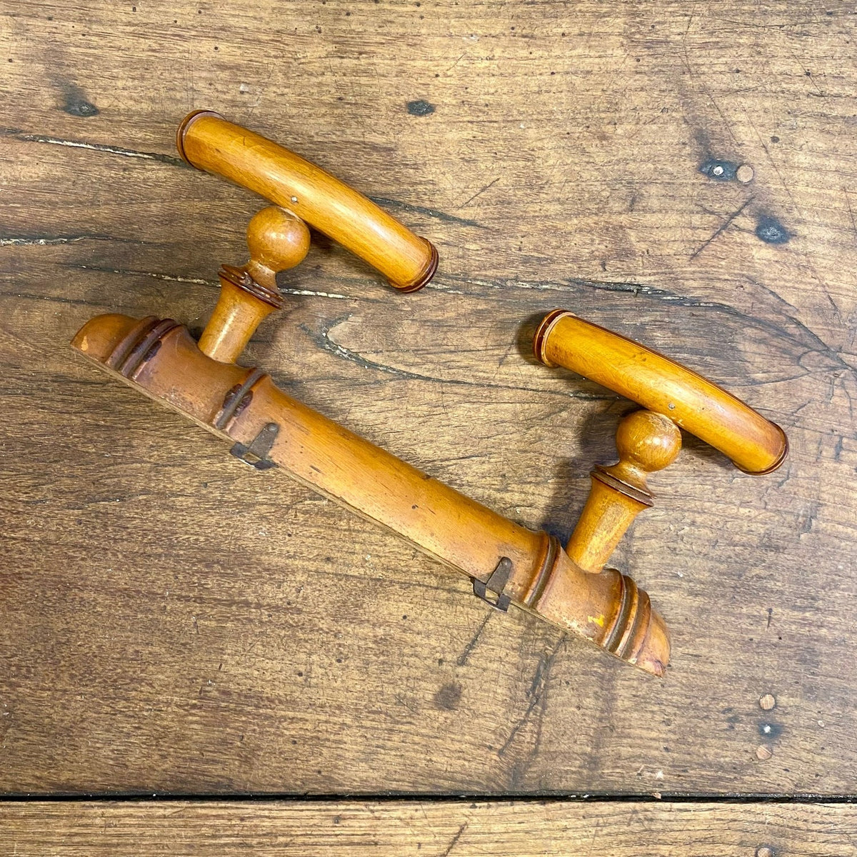 Vintage French double wall hook with two curved hooks on a turned rail with ringed detailing