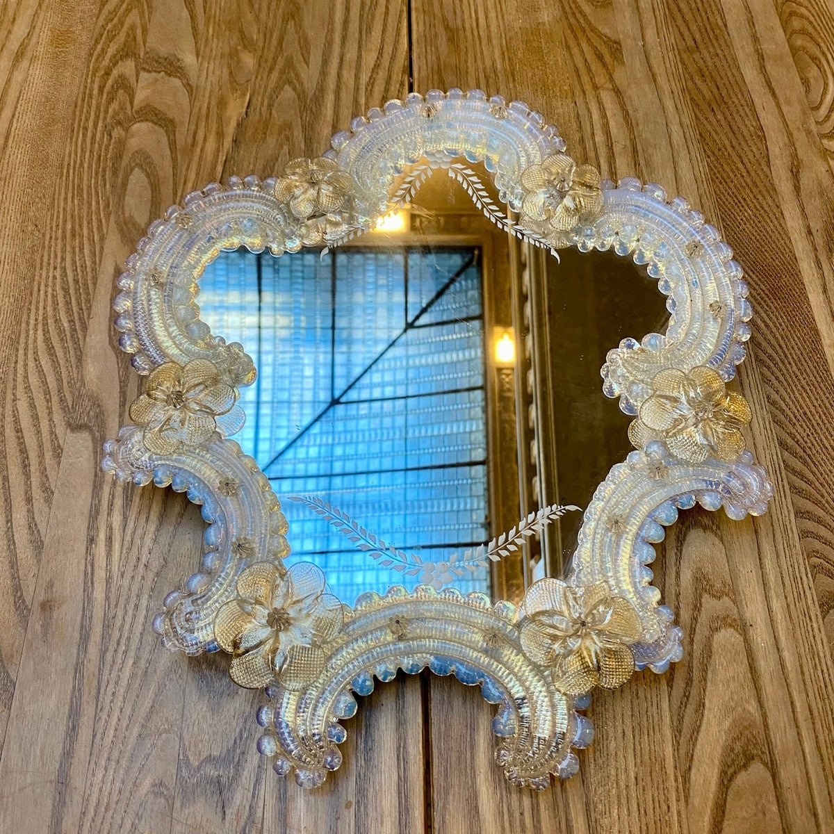 Vintage Venetian mirror with an opalescent glass frame and etched leaf sprays on the mirror