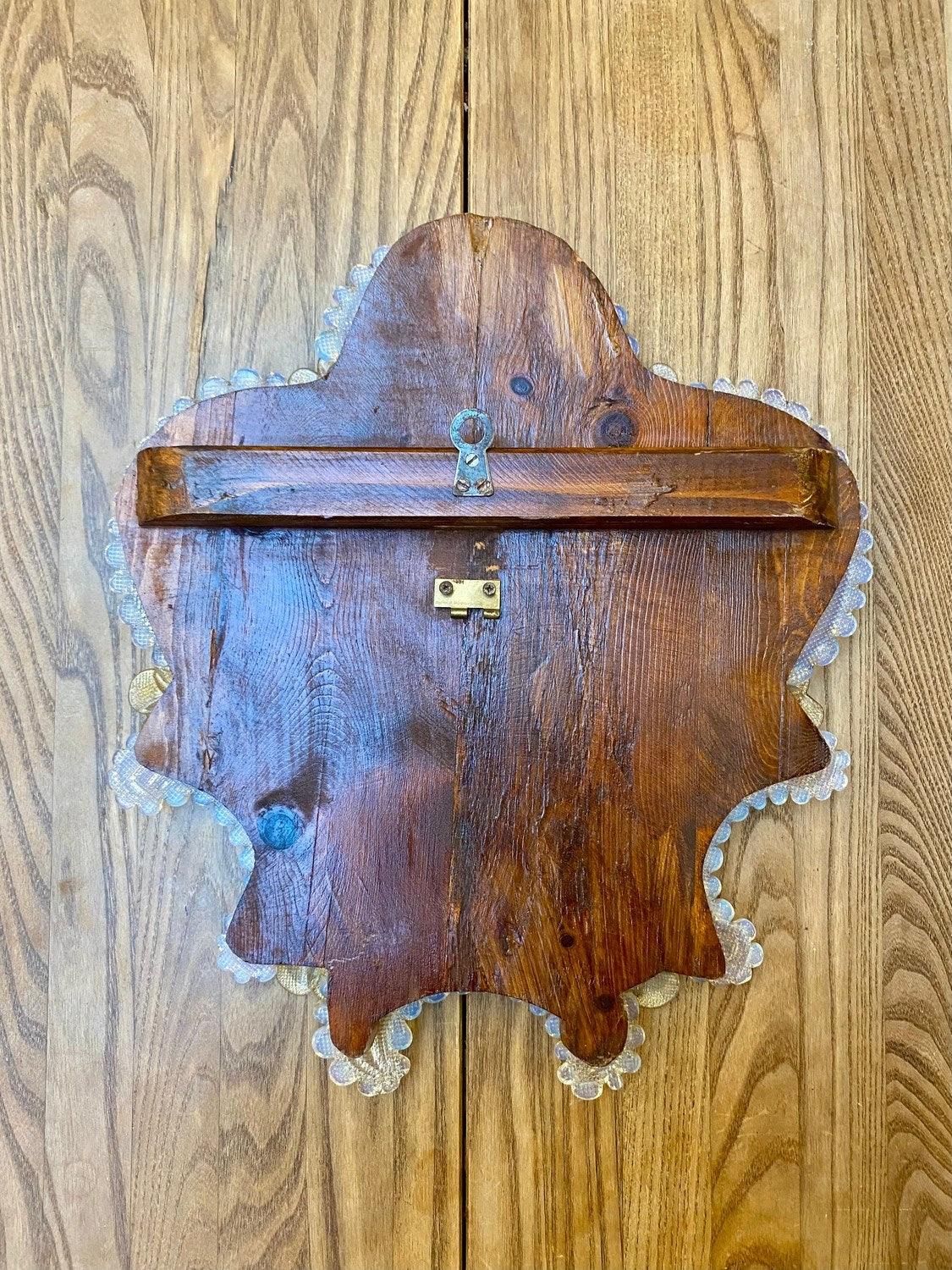 Back of a vintage Venetian mirror with its hanger