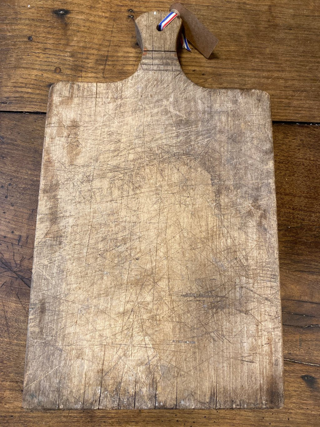 An old wooden cutting board.