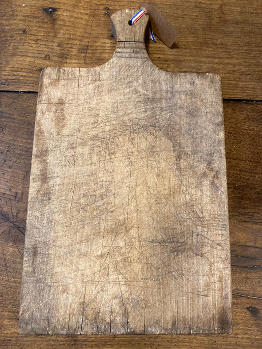 An old wooden cutting board.