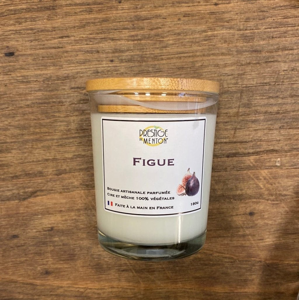 picture of a fig scented candle with a wooden backgorund